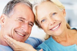 Closeup of a retired couple against bright background