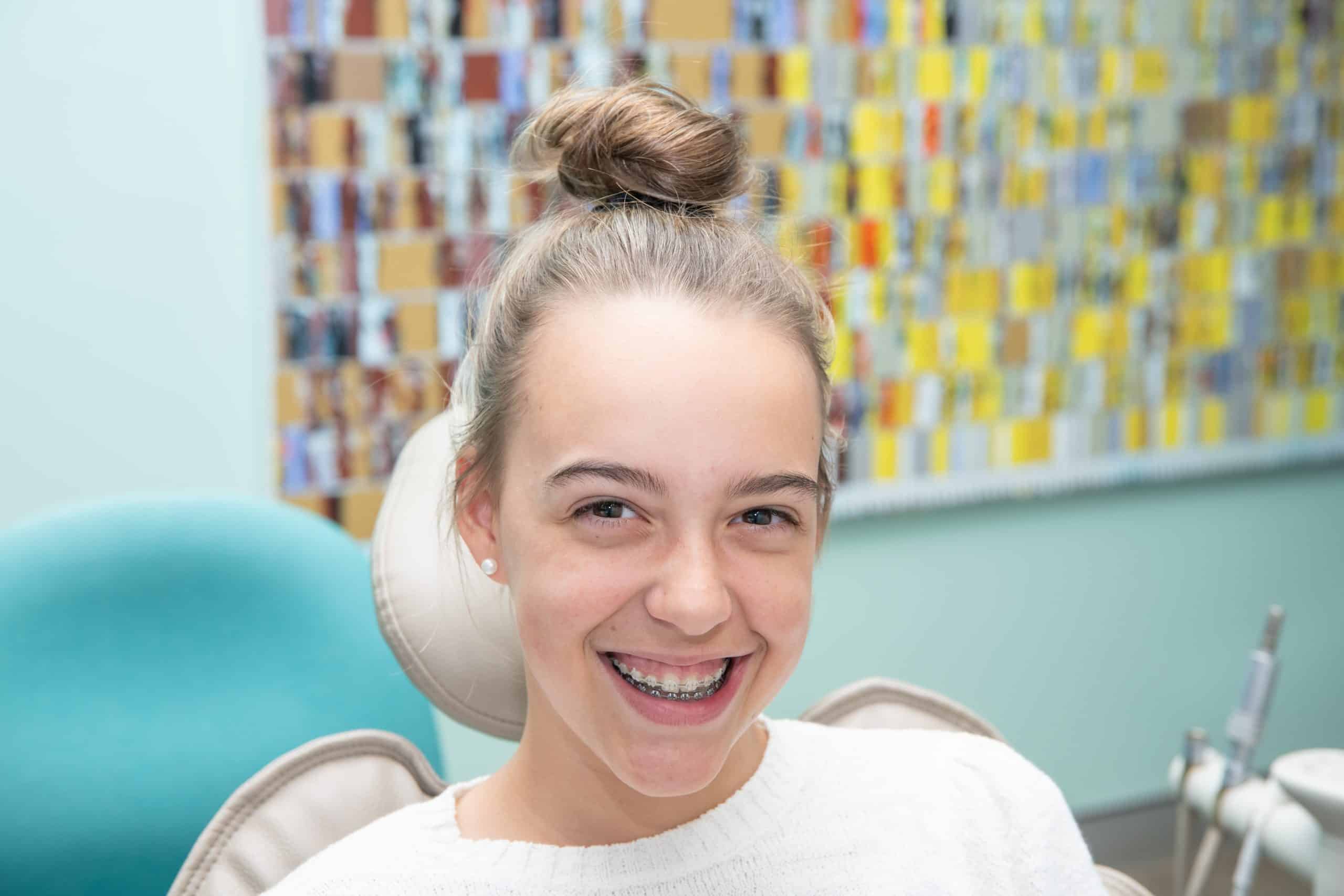 A girl smiling with braces